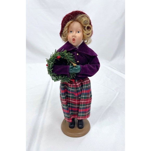 Female Christmas Caroler Blonde Woman With Wreath Purple Jacket